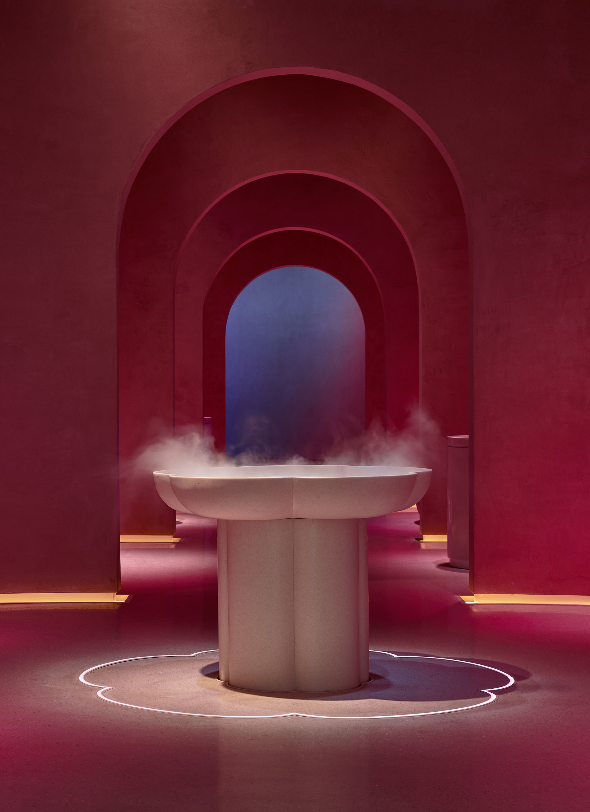 A view inside the spa with vapour pouring from a fountain.